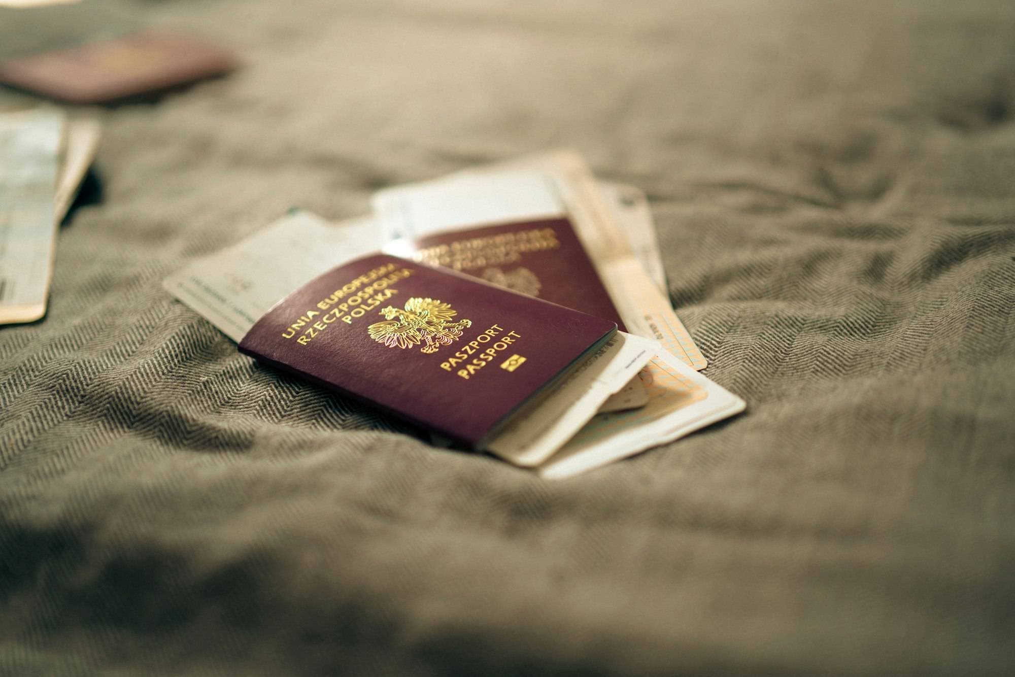 Passports and boarding passes on a linen surface