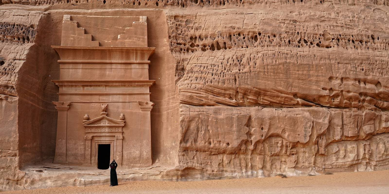 A Nabataean tomb carved into the sandstone at Hegra, AlUla